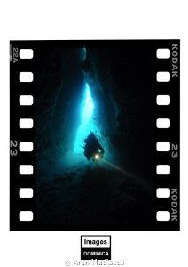 Diver entering the cave at Pointe Guignard by Arun Madisetti 